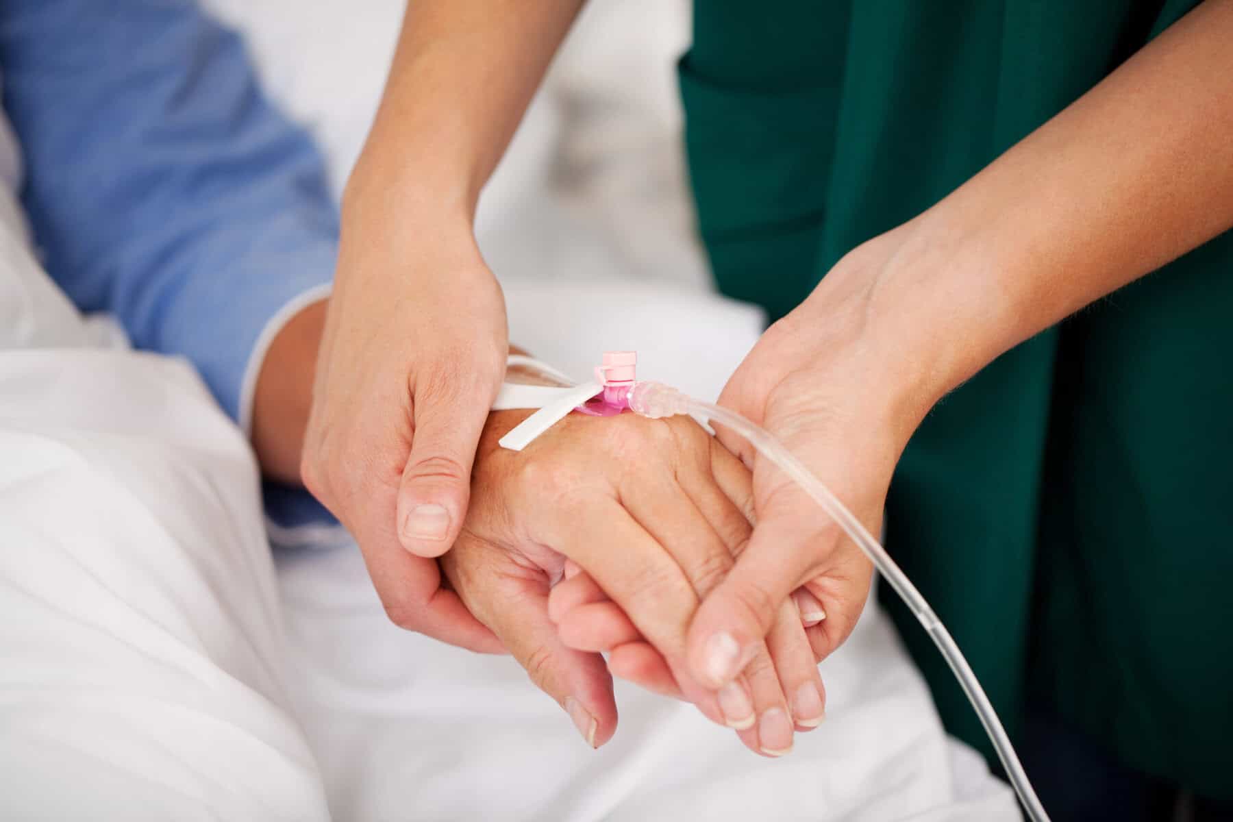 Depositphotos_26498195_XL Intravenous therapy being administered to a patient in a medical setting.